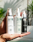 Three skincare products from Simplicity Code held in a hand with a blurred natural background